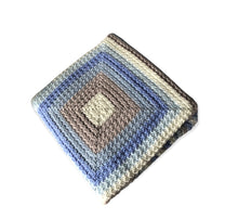 Load image into Gallery viewer, Keep baby warm in this soft, handmade blanket. The colors are white, tan, three shades of blue.    Size: 41&quot;L x 41&quot;W.  Pictured is the design in the center of the blanket. 
